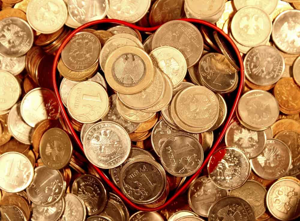 Gold coins lying on top of a table.