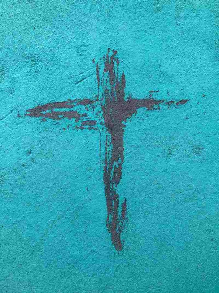 A cross on a blue wall.