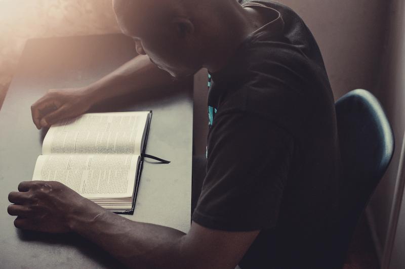 A young man reads scriptures about the ephod.