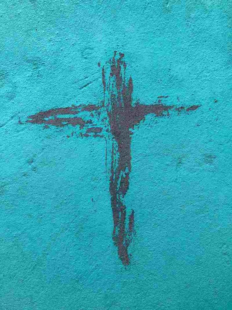 A cross on a blue wall.